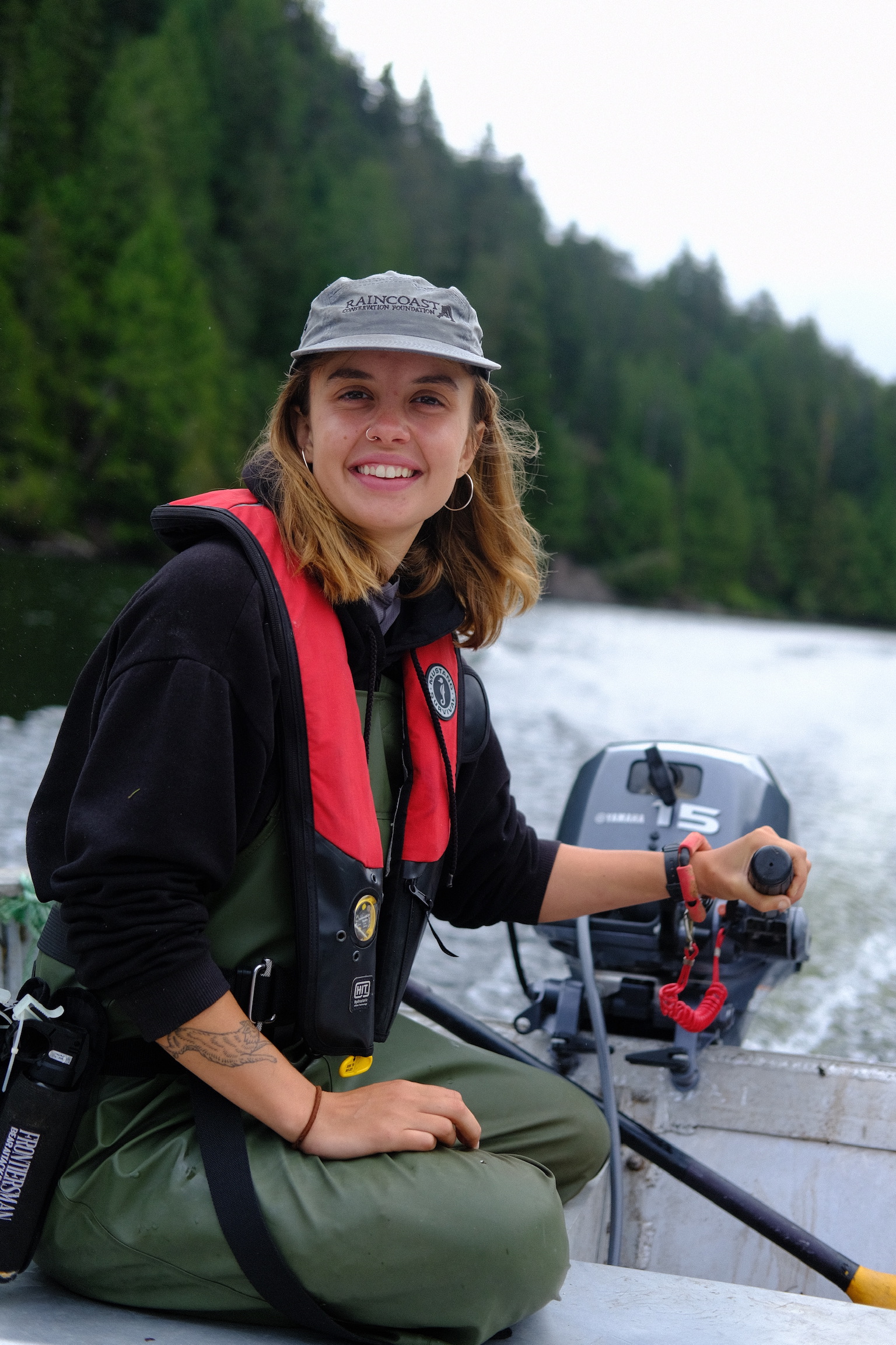Amanda Ketch drives a research zodiac through the water on the Central Coast of British Columbia.